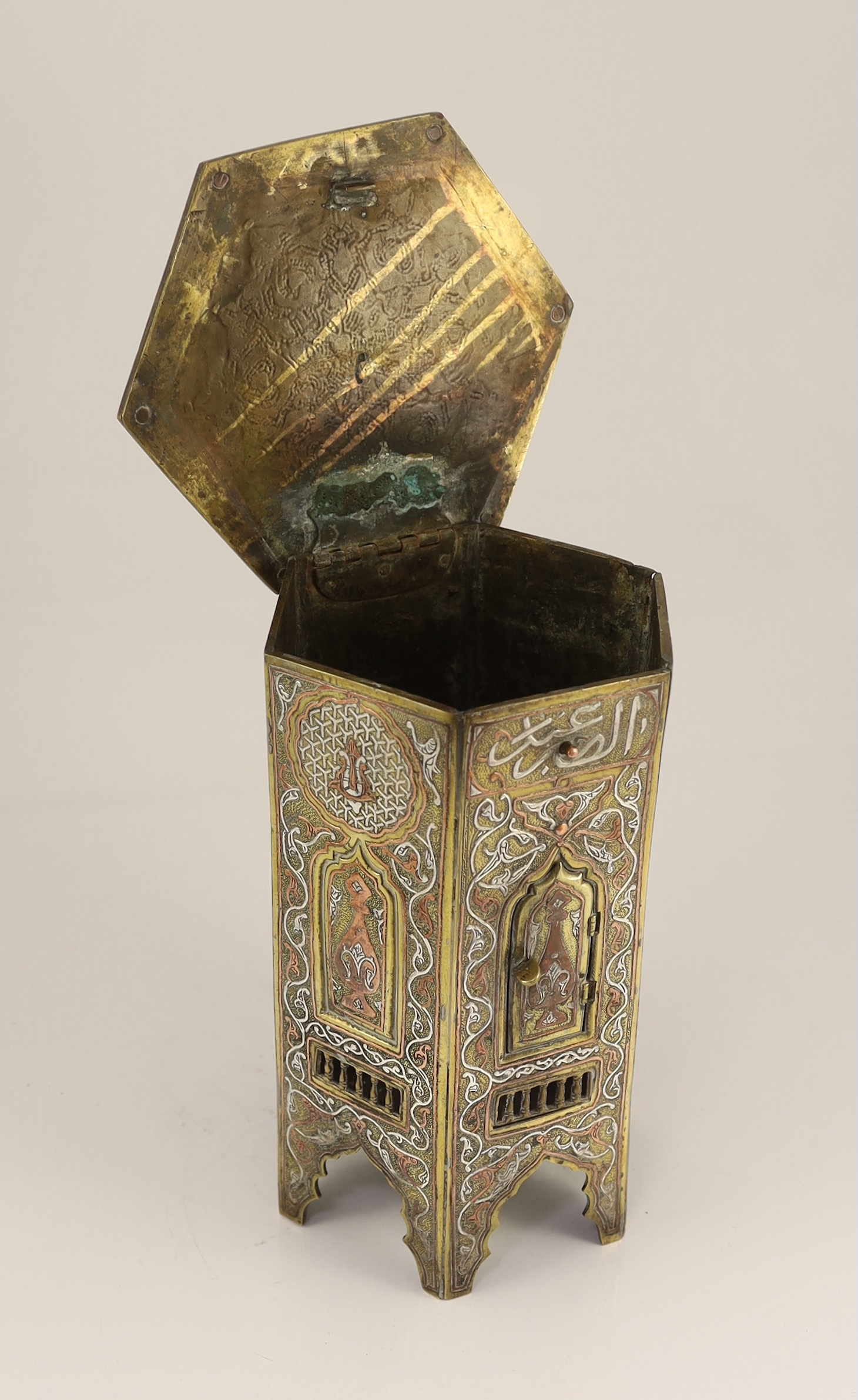 A Cairo ware silver and copper inlaid brass Qur’an stand, early 20th century